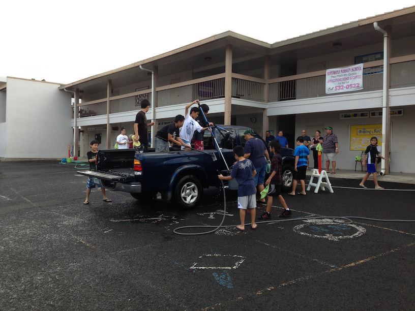 Fifth graders from Hongwanji Mission School in Hawaii put on a car wash to raise money to lend on Zidisha!