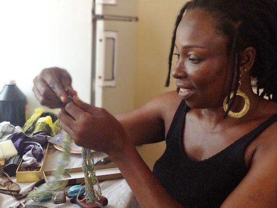 Love, a widowed mother in Ghana, teamed up with Zidisha lenders to start a jewelry design business to support her family.